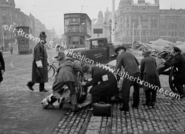 FALLEN HORSE AT O'CONNELL BRIDGE, WITH CROWD & TRAM